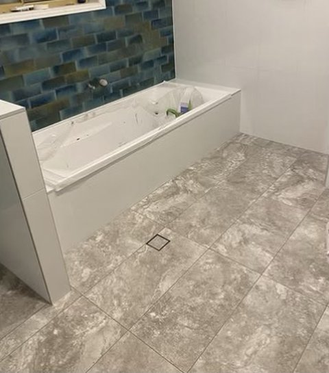 Bath with blue feature tiles